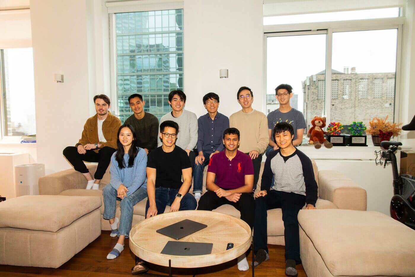 Cognition’s early ten-person team gathered around sofas and a coffee table