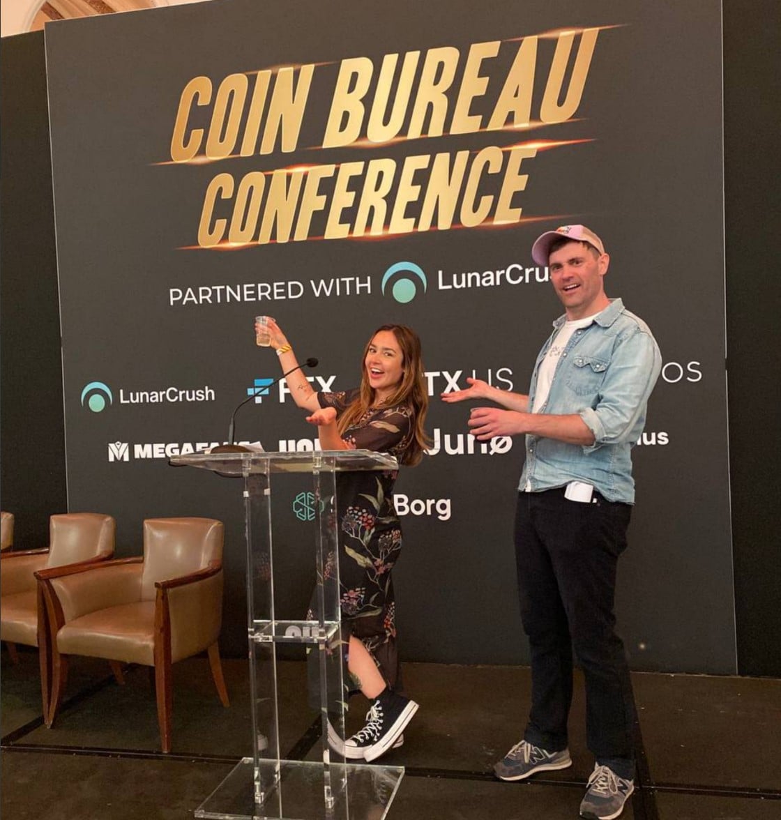 Guy Turner and Macey onstage at the Coin Bureau Conference in 2022