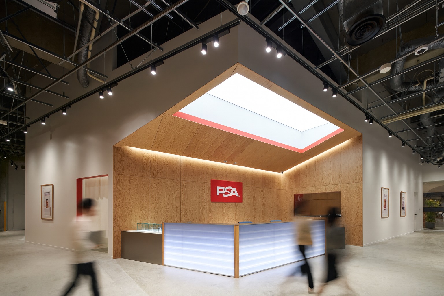 PSA reception area with wood-paneled walls and illuminated counter