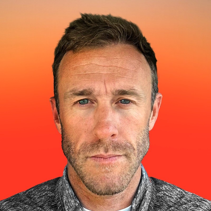 Column Five co-founder Josh Ritchie against an orange background
