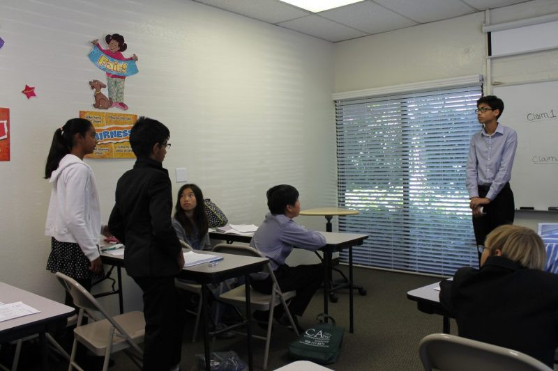 Students taking part in a debate exercise at Communication Academy