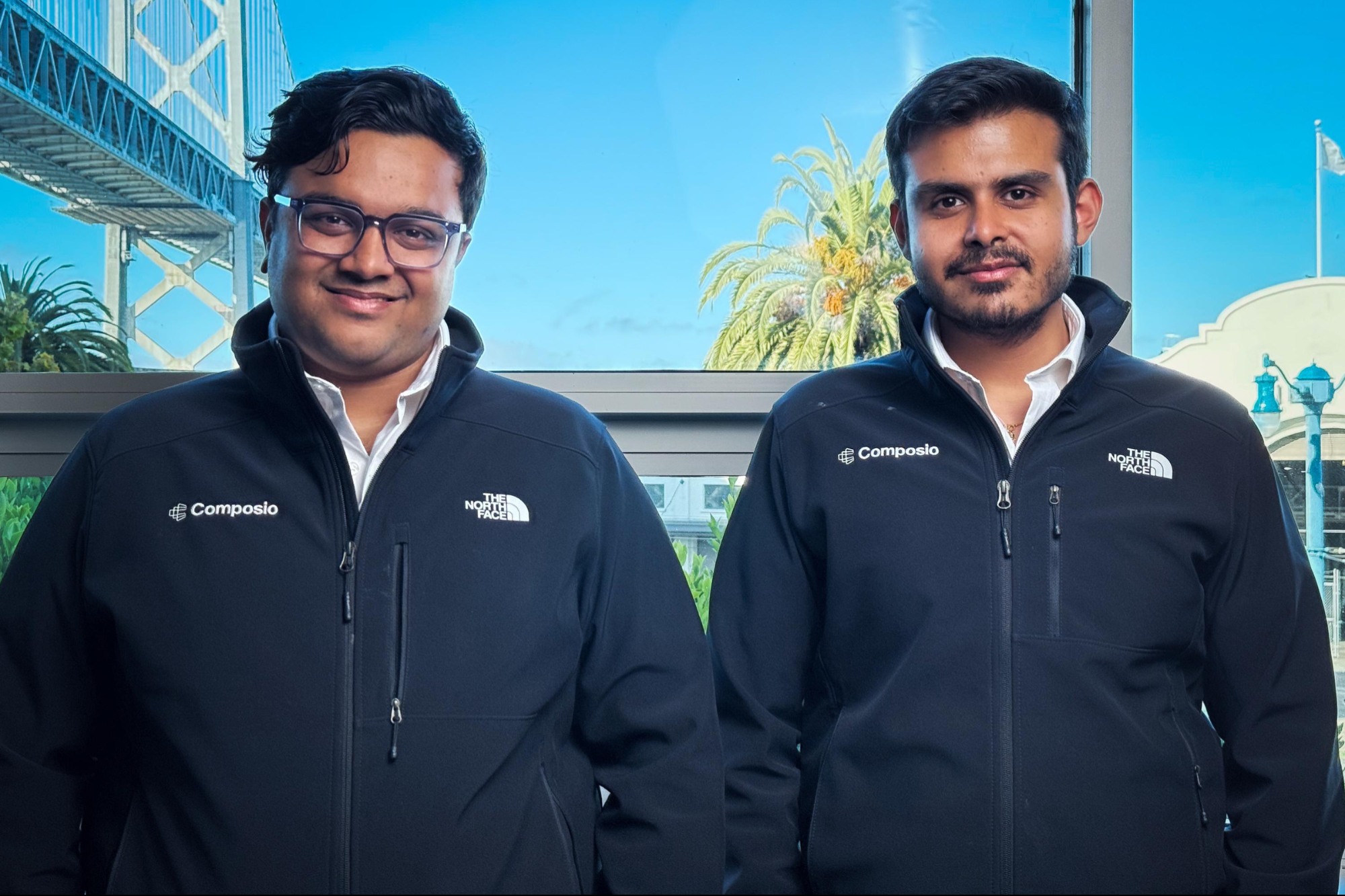 Composio co-founders Soham Ganatra and Karan Vaidya standing together in San Francisco