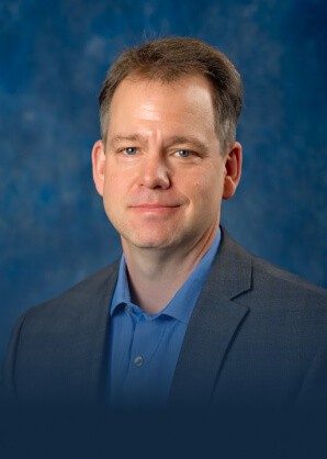 Official portrait of CompuNet founder and president Nolan Schoo