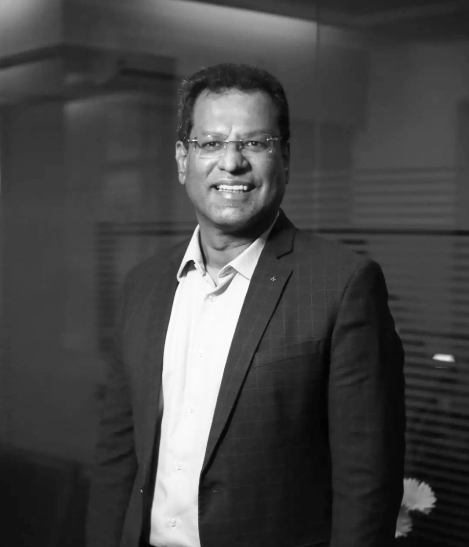 Comviva CEO Rajesh Chandiramani in an official black-and-white portrait