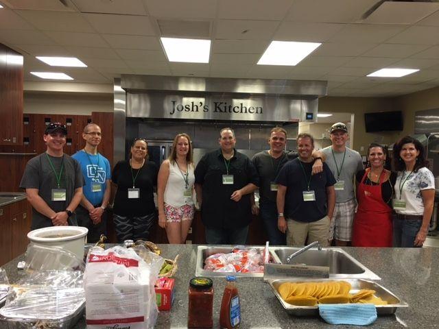 ConsultNet Salt Lake City team volunteering at Ronald McDonald House in an archival company photograph