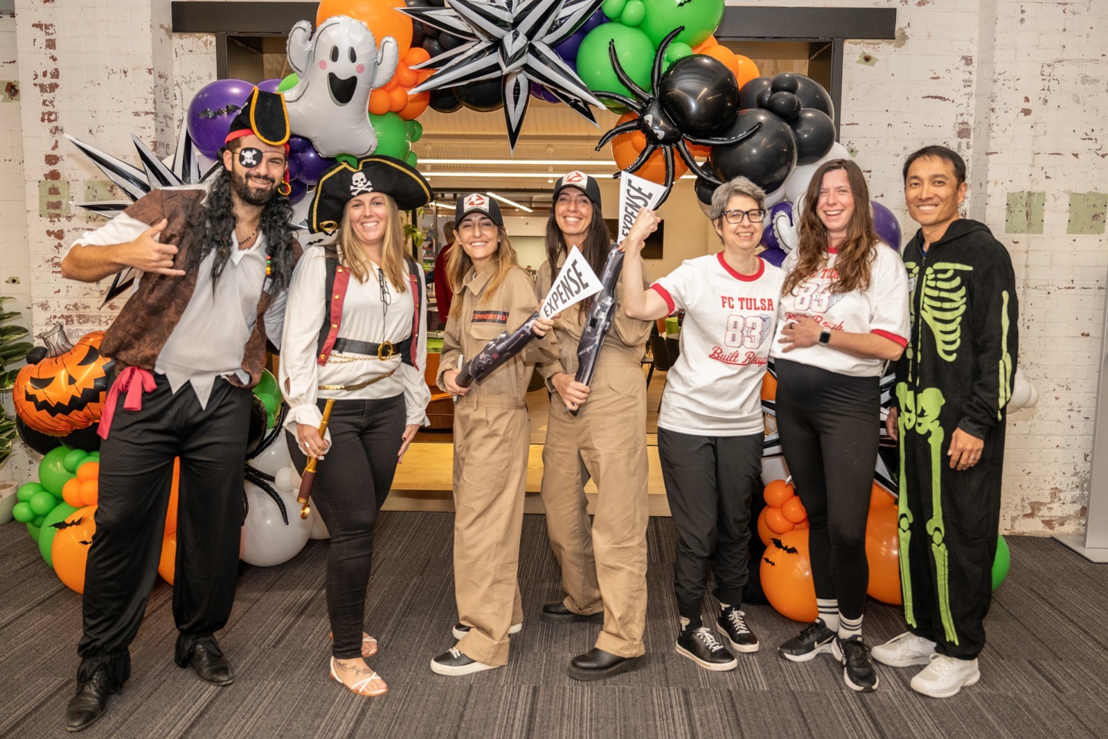 ConsumerAffairs colleagues wearing Halloween costumes in their office