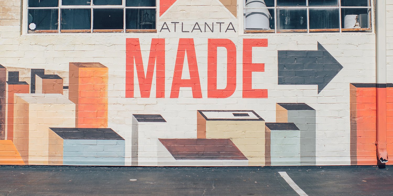 A colorful Atlanta Made mural painted on a brick wall