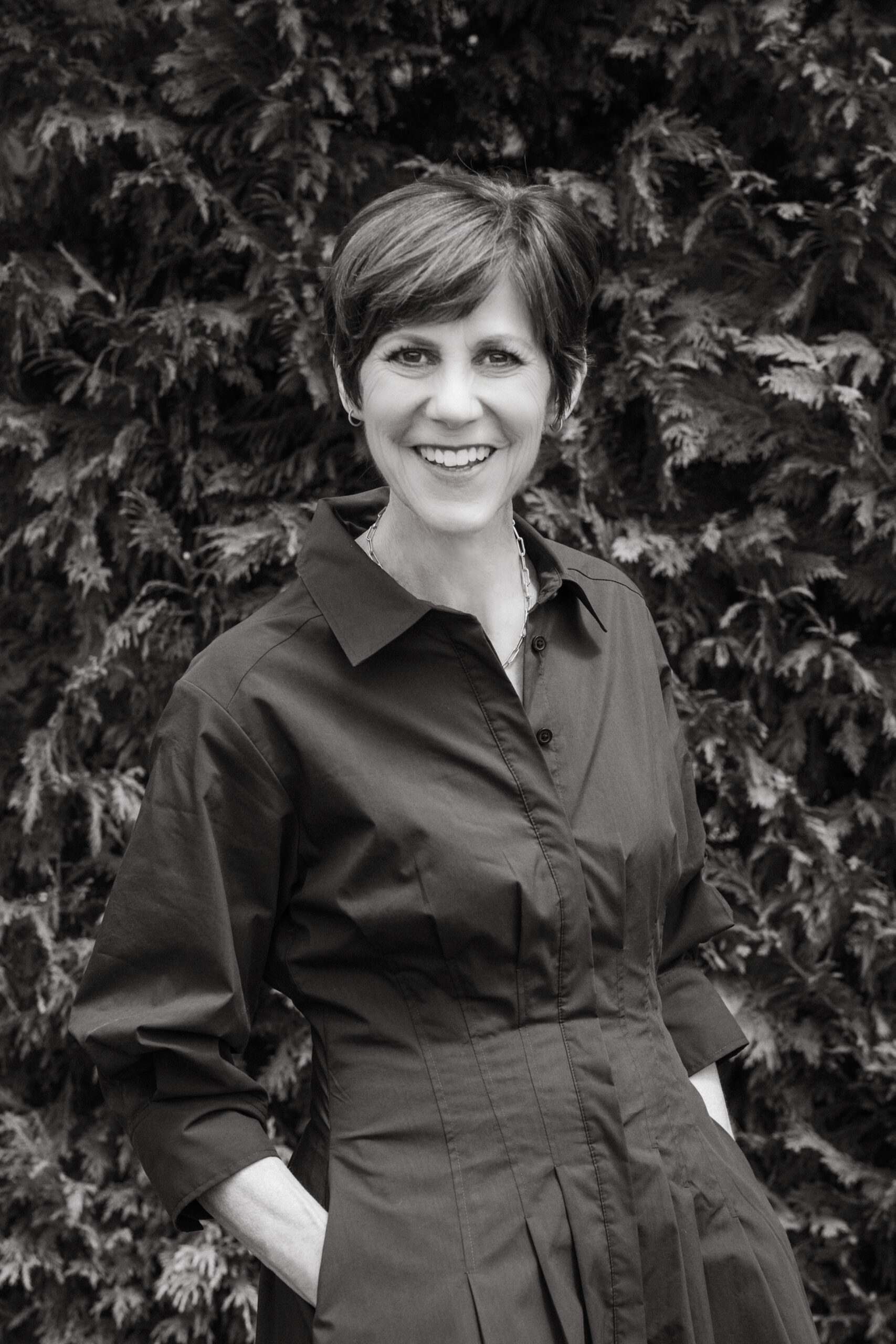 CookIt Media founder Laurie Buckle smiling in a black-and-white portrait