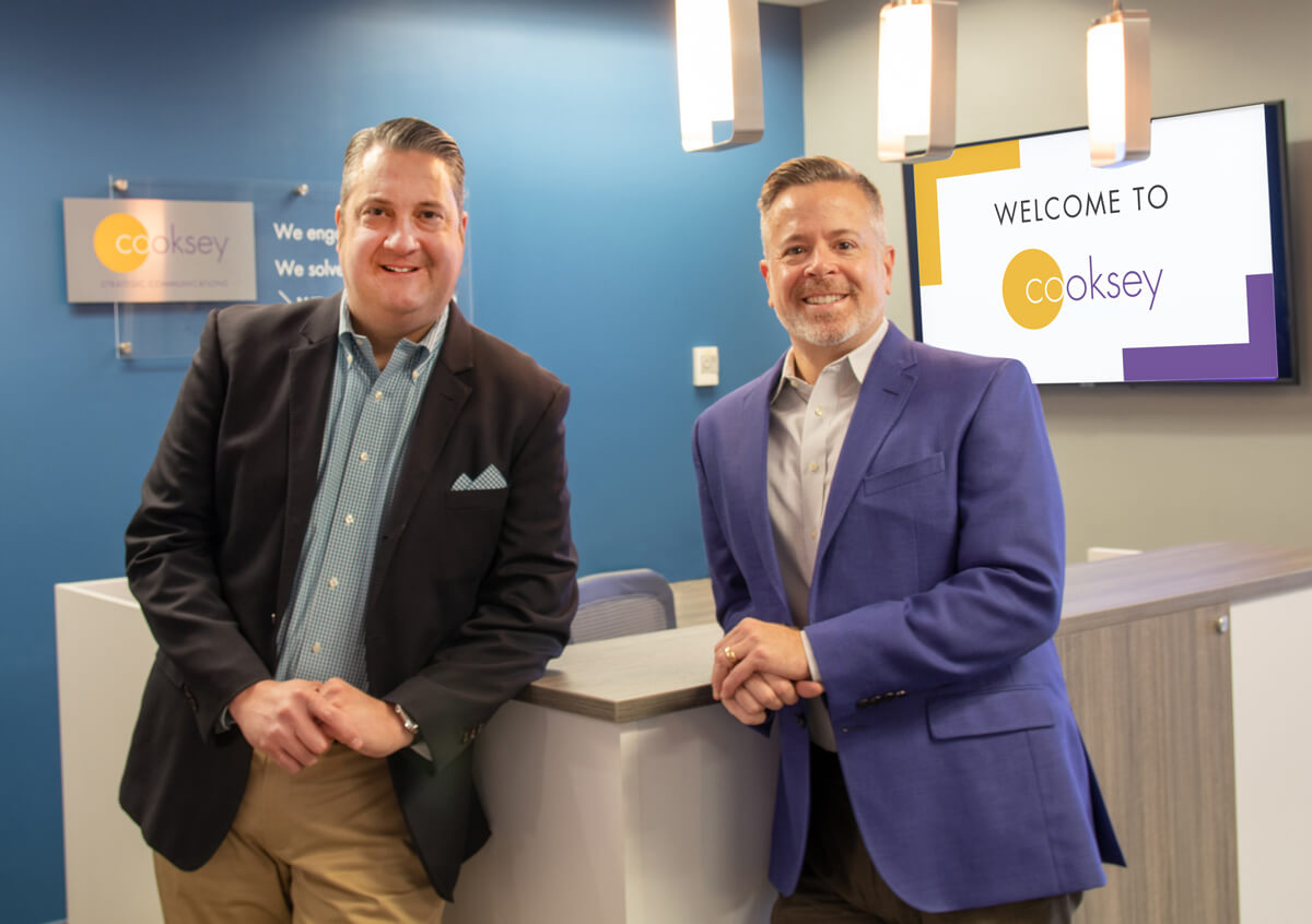 Cooksey leaders Colby Walton and Jason Meyer standing in the agency's Irving office