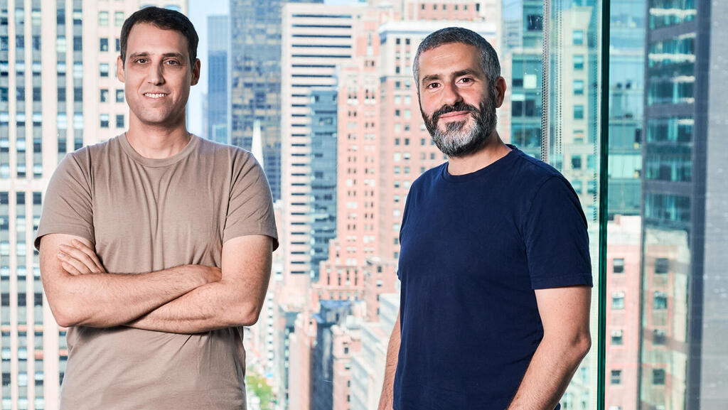 Coralogix co-founders Ariel Assaraf and Yoni Farin standing in an office