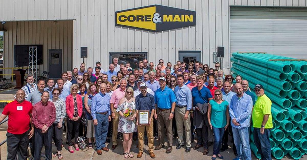 An archival gathering of Core & Main employees outside a company facility