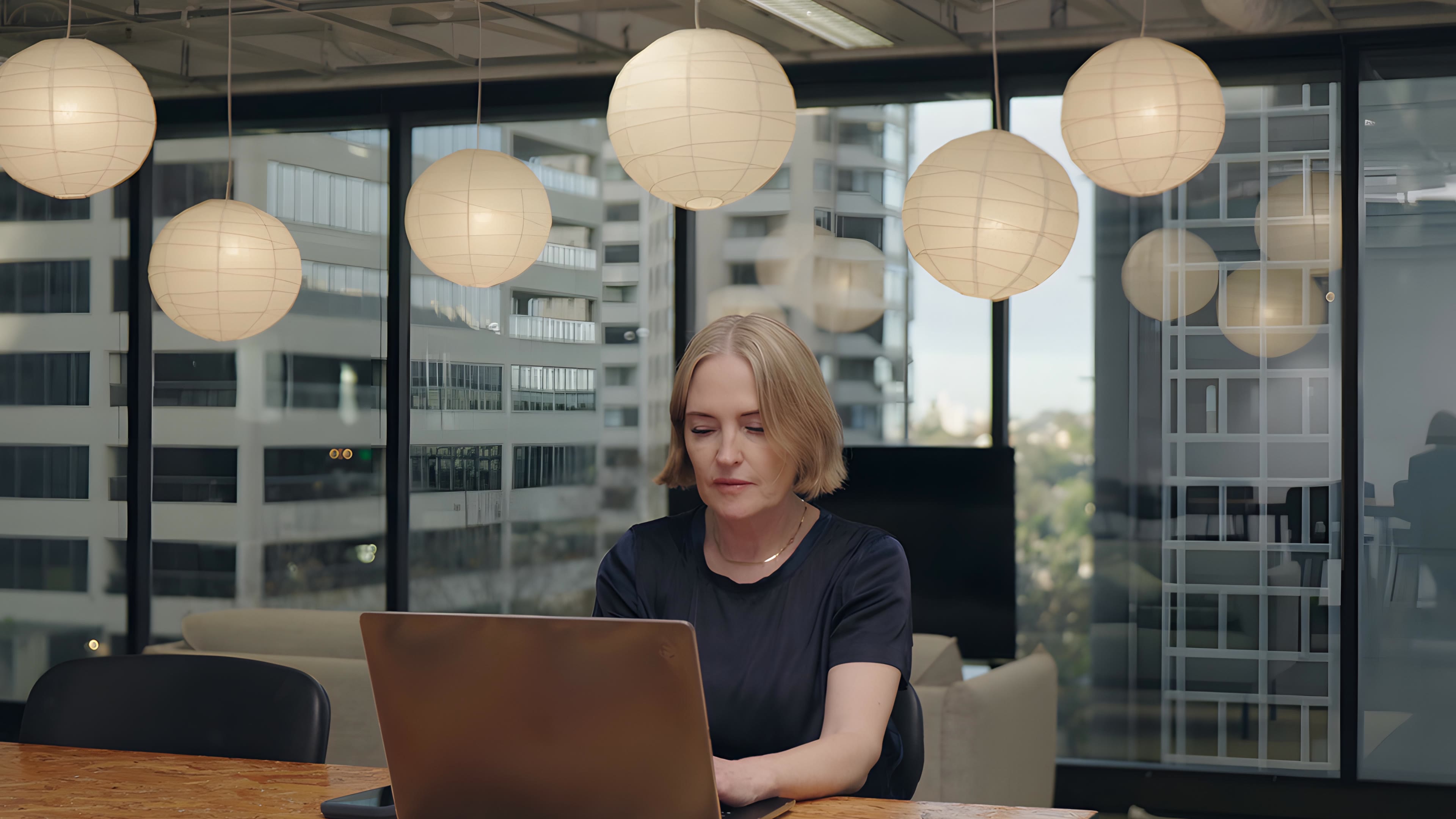 Katrina Leslie, founder of Corestaff’s parent company swipejobs, working at a laptop