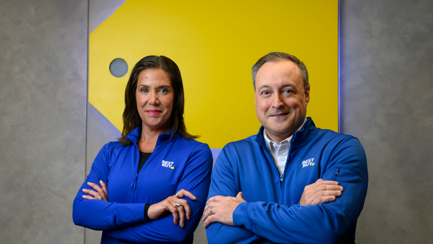 Corie Barry, left, standing beside incoming Best Buy CEO Jason Bonfig