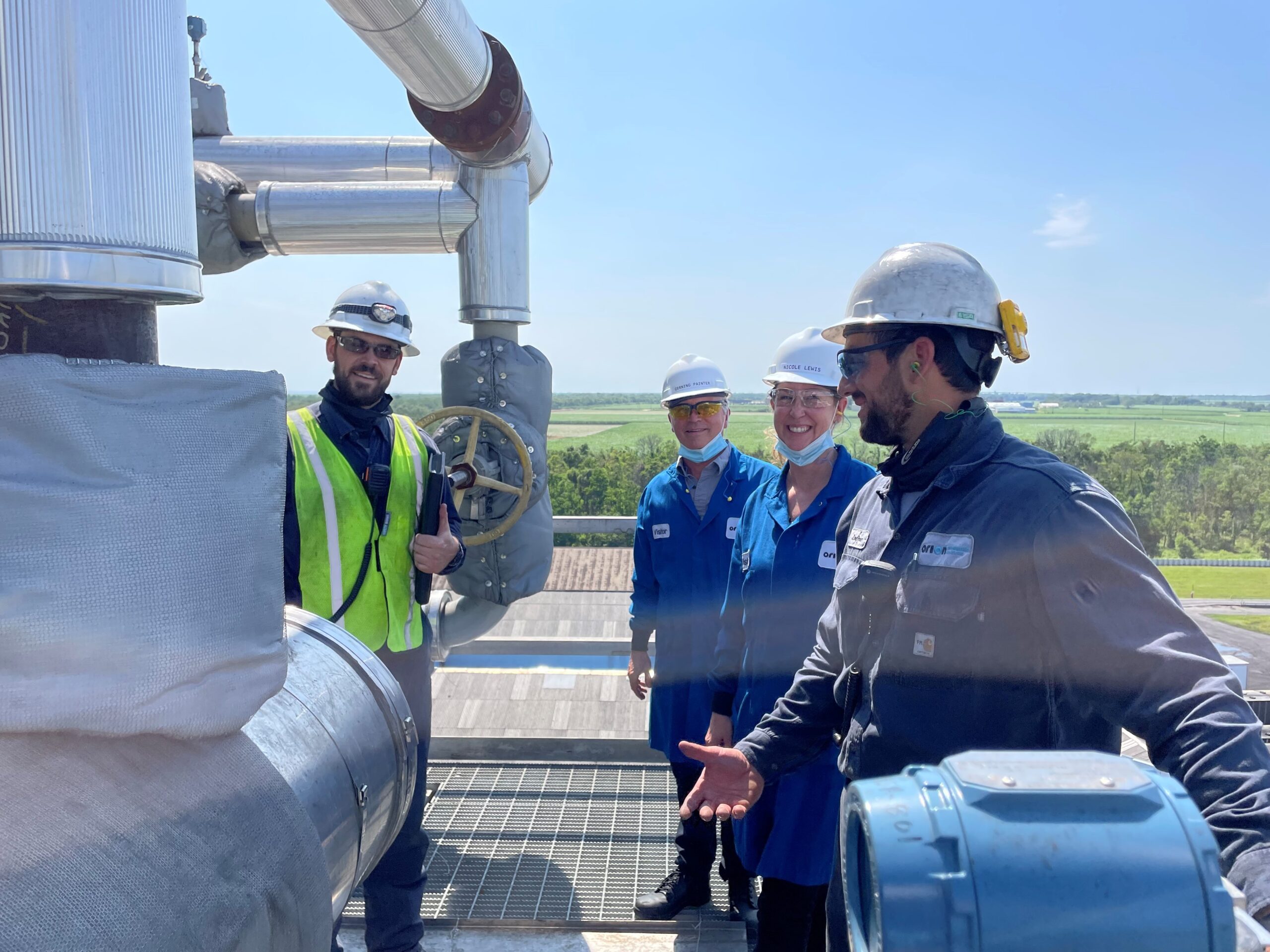 Corning Painter, center, visiting the air-emissions control installation at Orion’s Ivanhoe plant