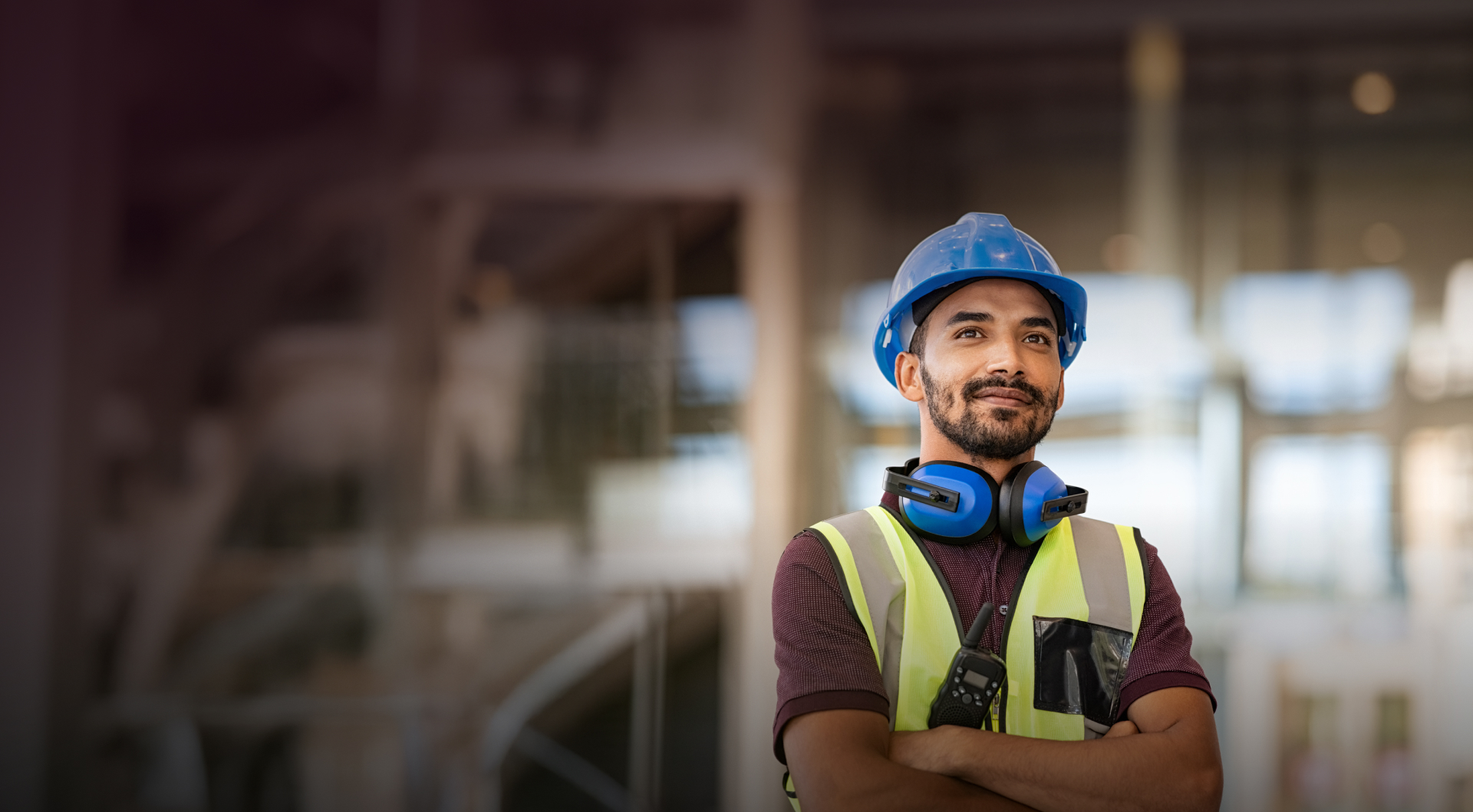 Construction worker wearing a hard hat on a job site