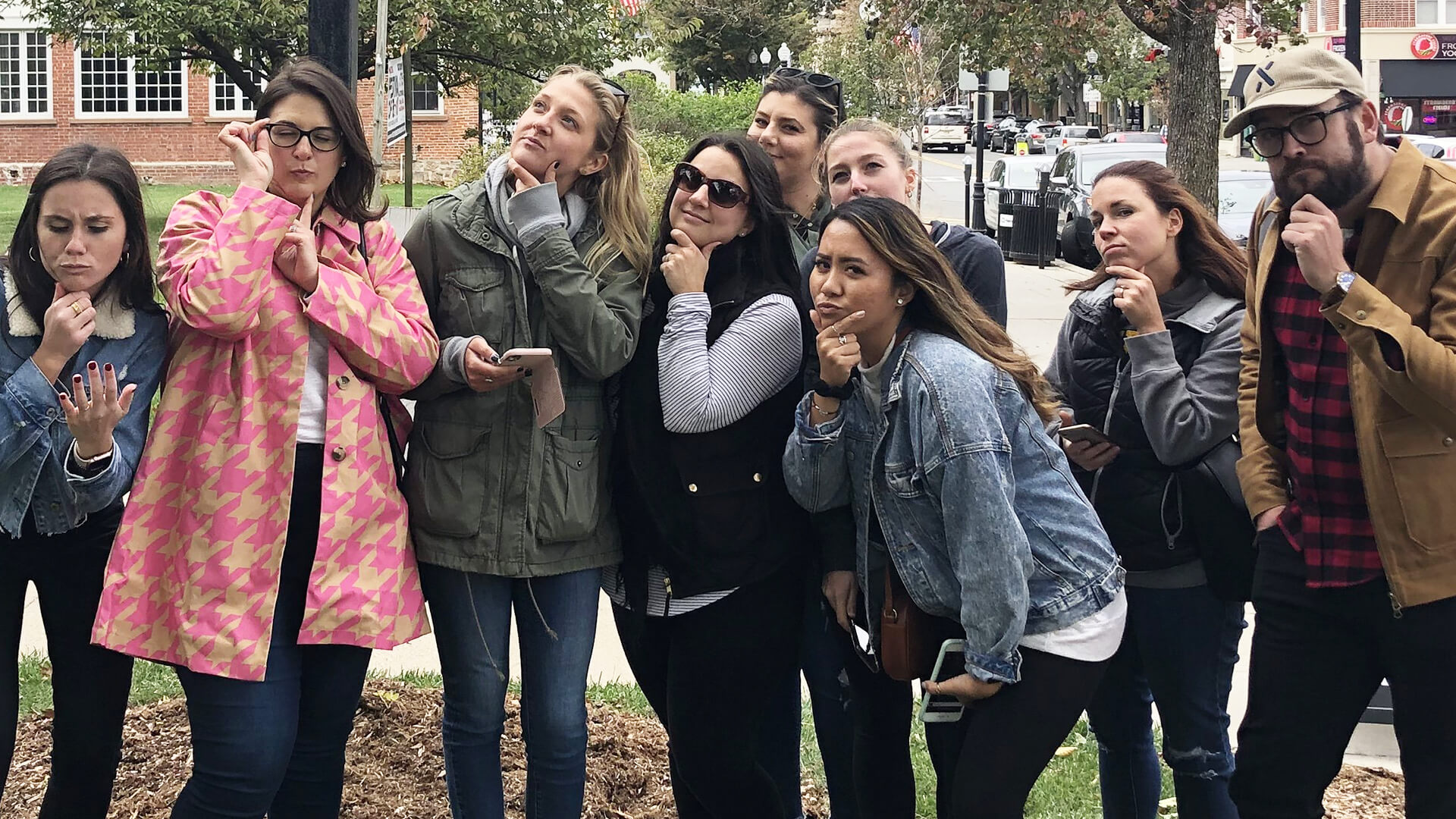 Eight Coyne PR colleagues posing thoughtfully outdoors