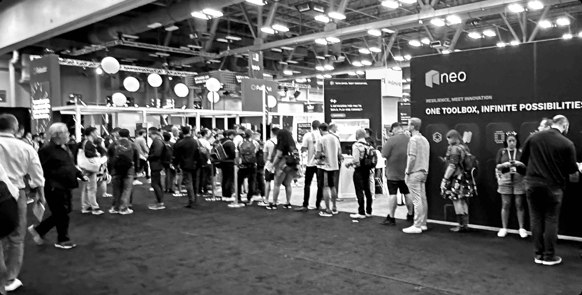 Visitors queue around the Neo booth at Consensus 2023