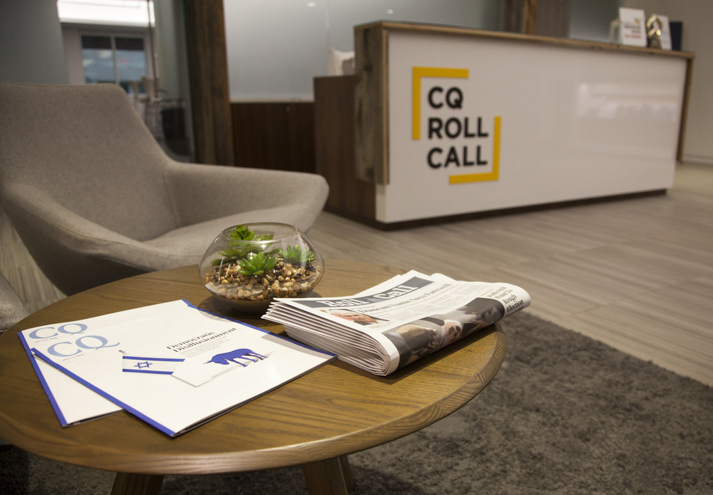 CQ Roll Call reception area with newspapers and magazines on a low table
