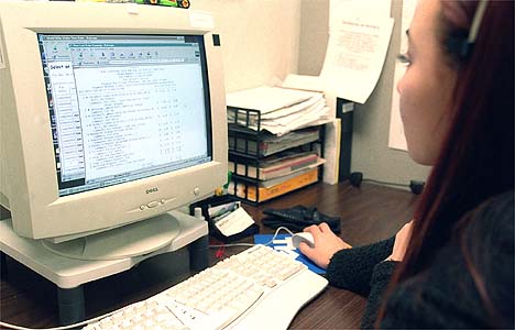 A Waiter.com worker processing an order at a desktop computer in Sunnyvale in 2000