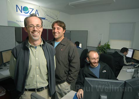 Craig Harris, center, with members of the NOZA team in a 2007 office photograph