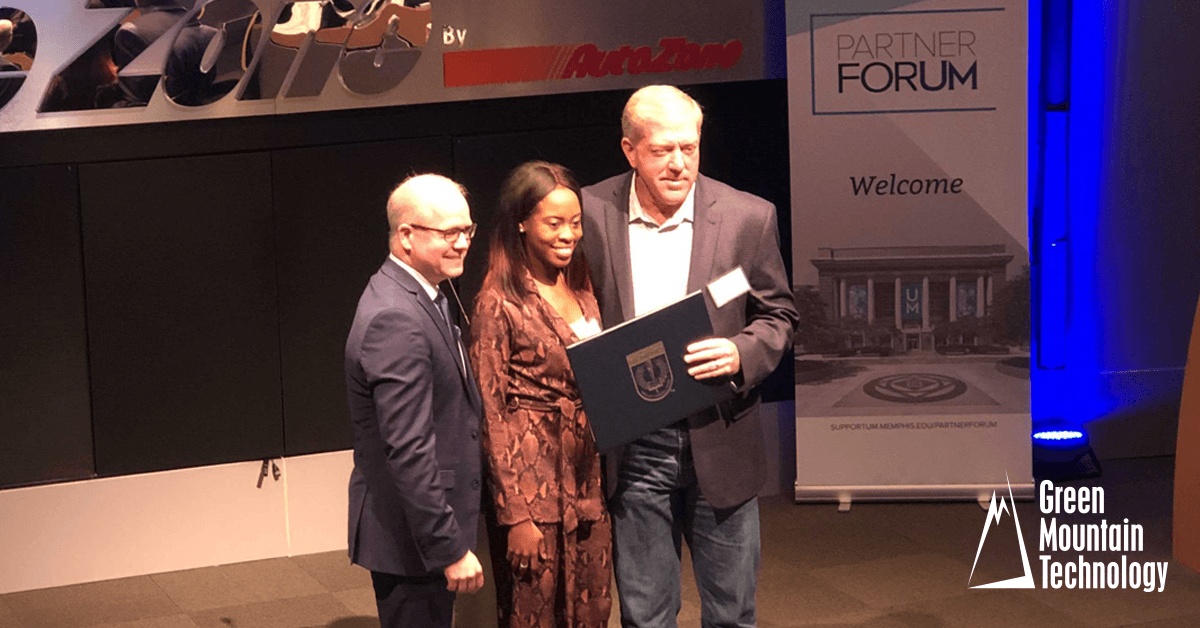 Craig Russell, at right, accepting Green Mountain’s Innovation Award at the University of Memphis Partner ForUM in 2019