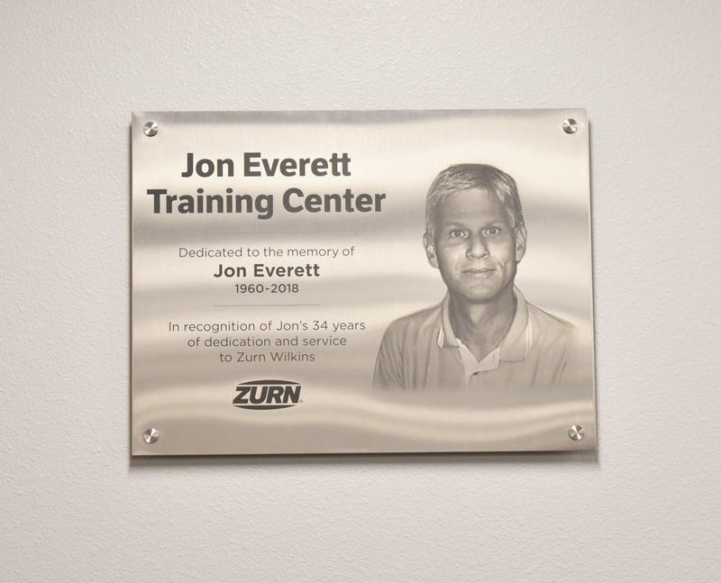 Dedication plaque for the Jon Everett Training Center, recognizing 34 years of service at Zurn Wilkins.