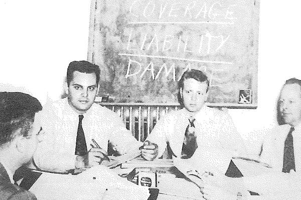 Early Crawford training session with employees around a table