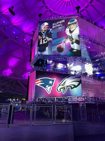 Large suspended graphics and branded displays at the Super Bowl Experience