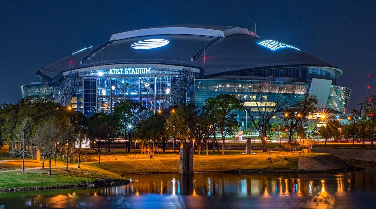 Illuminated exterior of AT&T Stadium at night