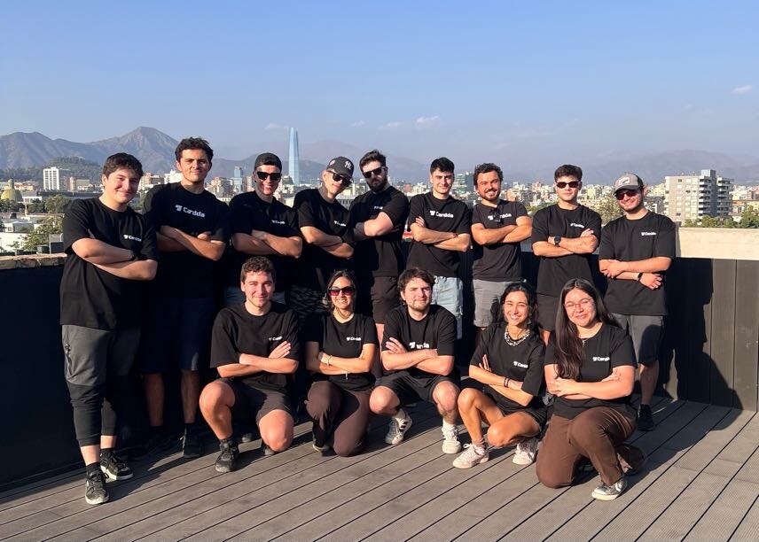 The Cardda team together on a Santiago terrace with the mountains behind them