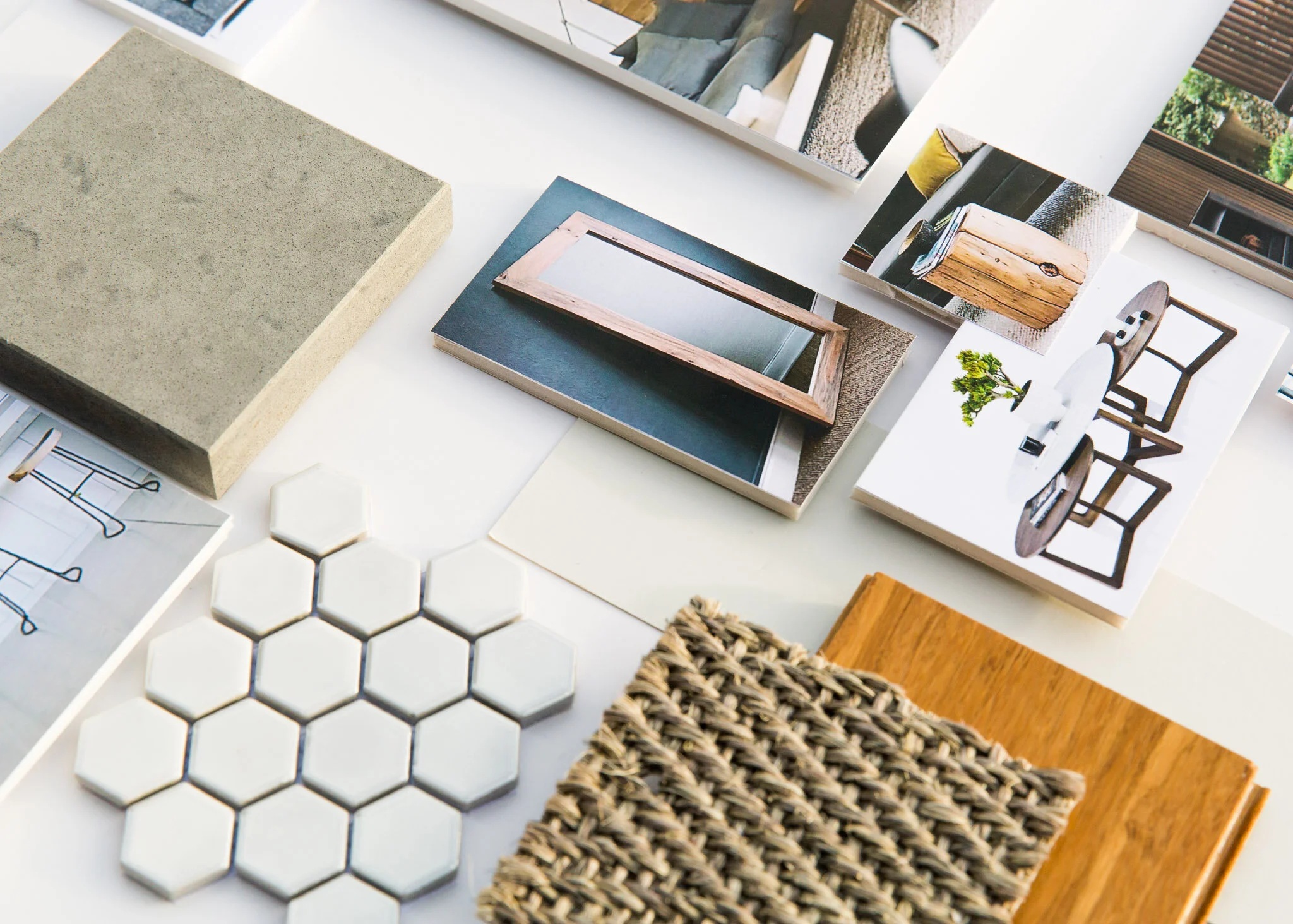 Interior design samples, tiles, wood, woven material, and reference photographs