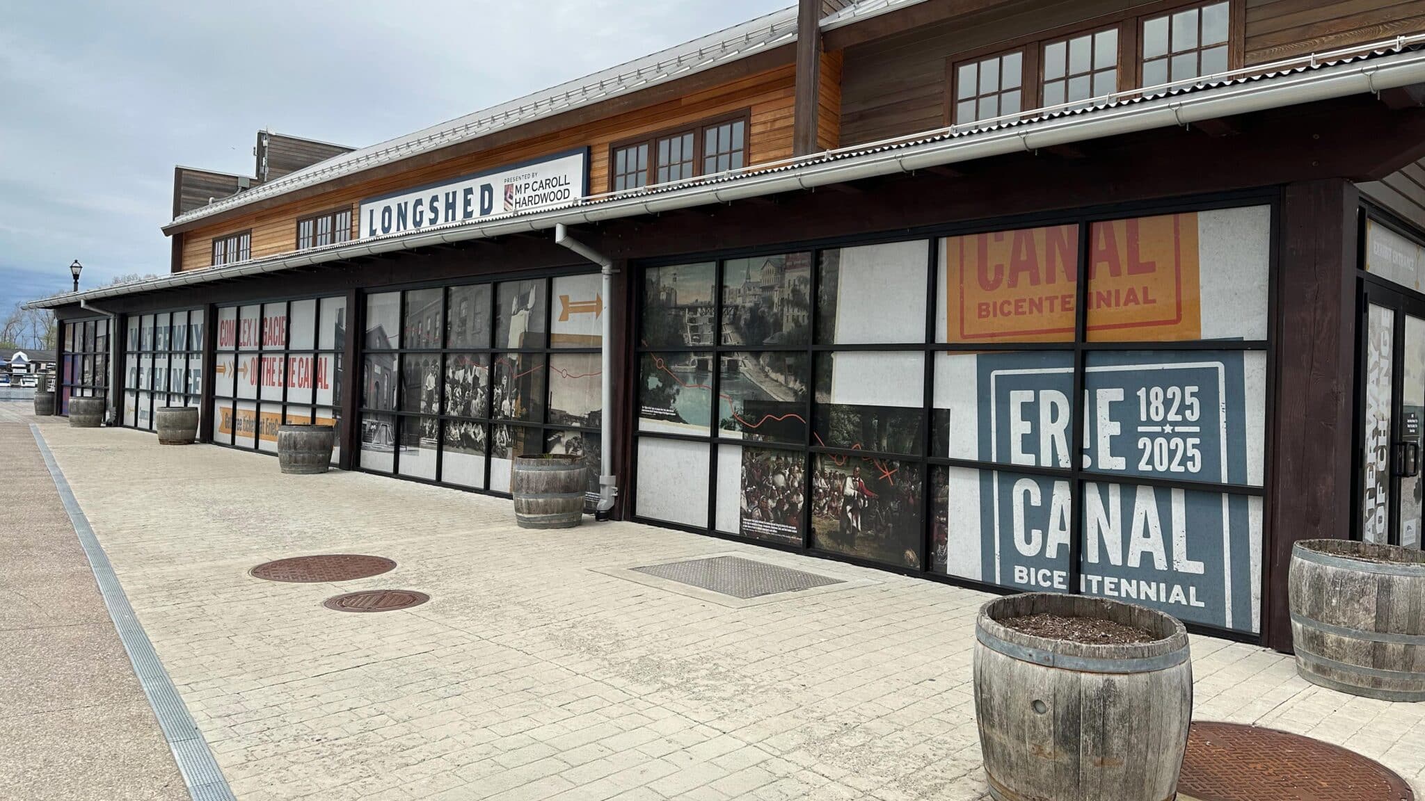 The Longshed at Canalside wrapped in Erie Canal bicentennial campaign graphics