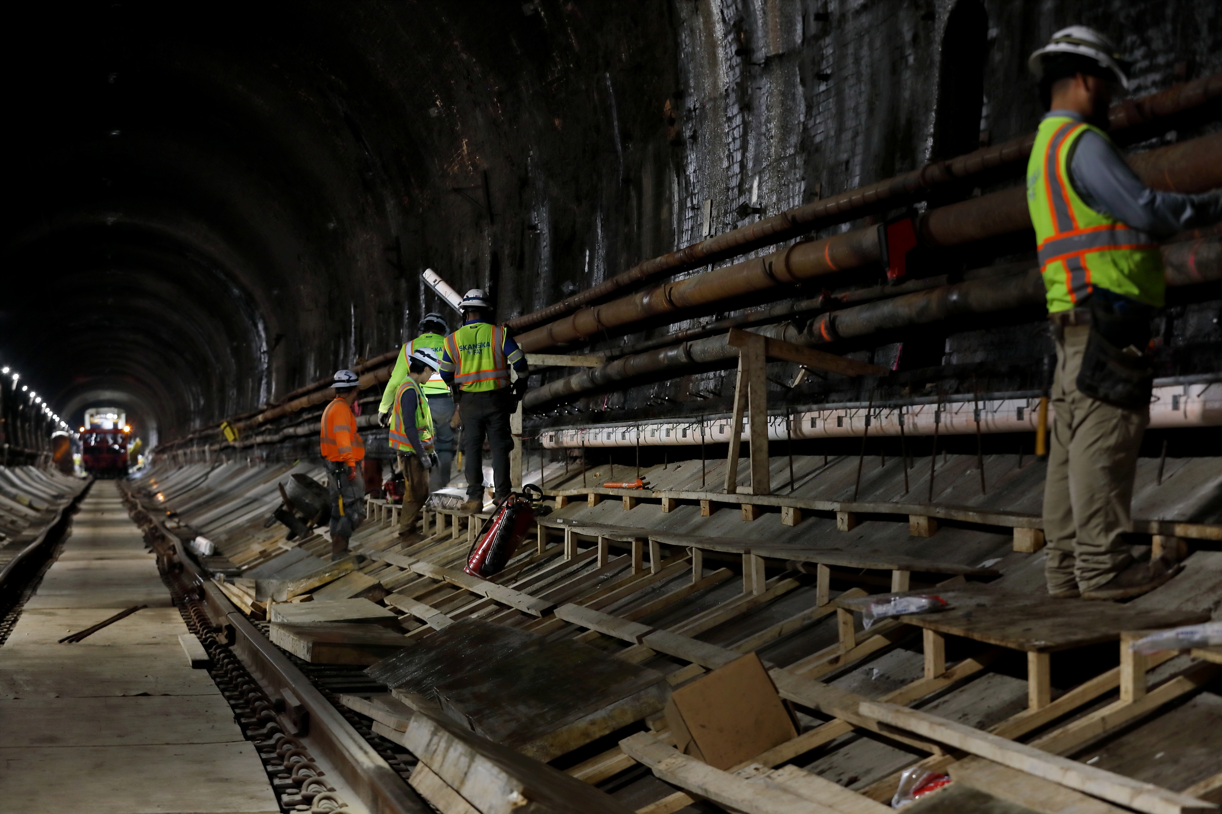 Construction crew inside the brick-lined Howard Street Tunnel during its floor-lowering project