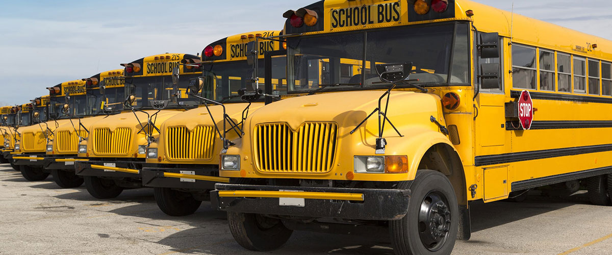 Rows of yellow school buses at the Navistar IC Bus plant