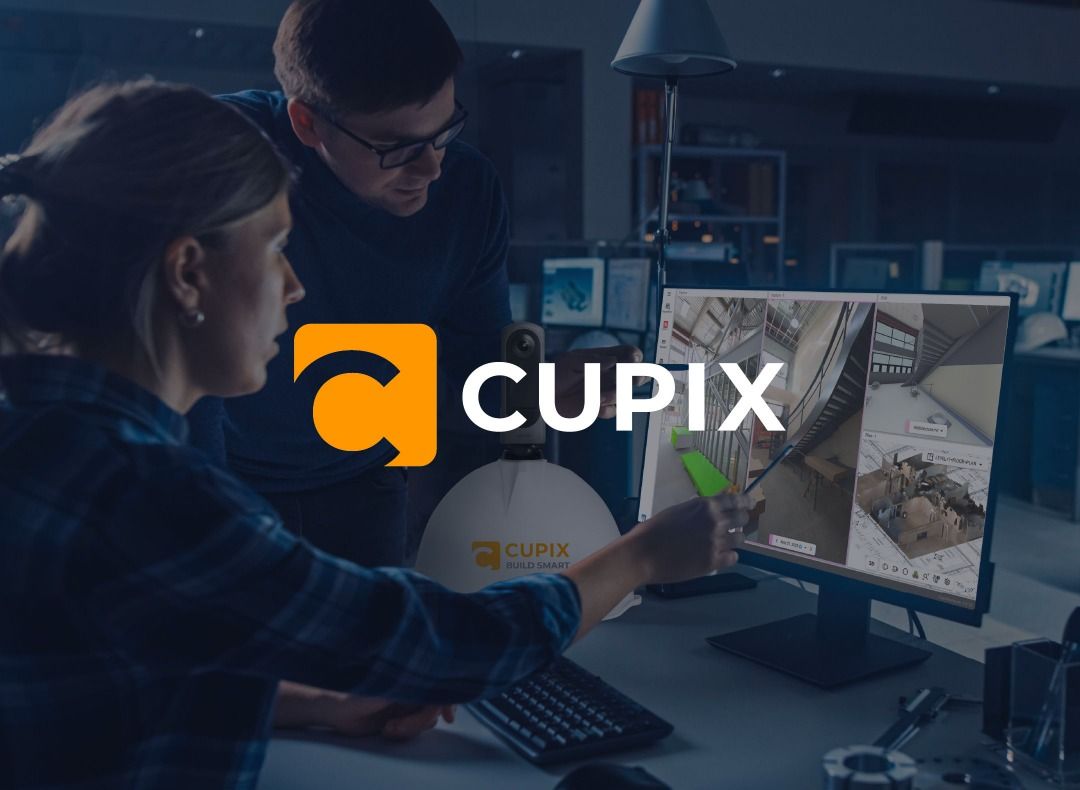 Cupix recruitment image of two people reviewing spatial views at a workstation
