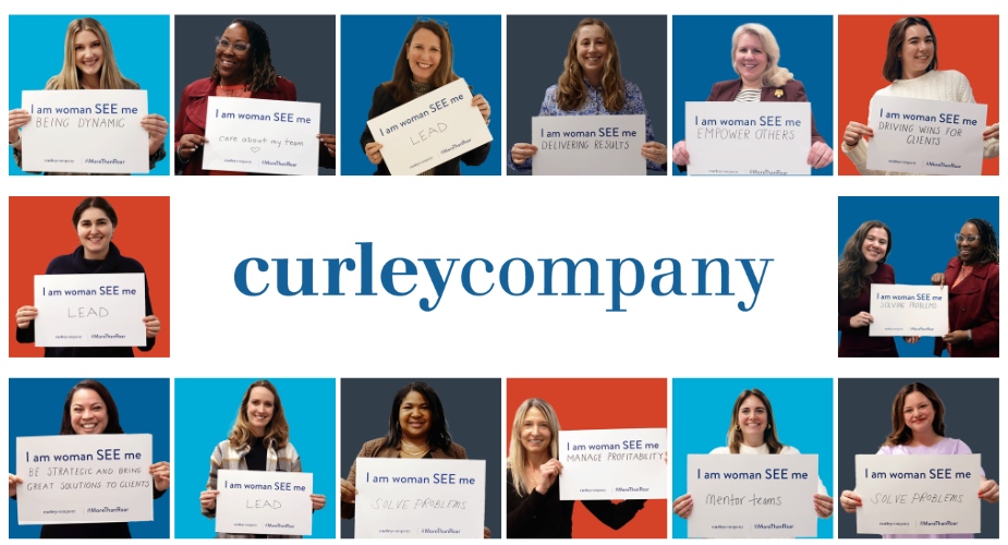 Curley Company team members holding handwritten signs about how they contribute at work