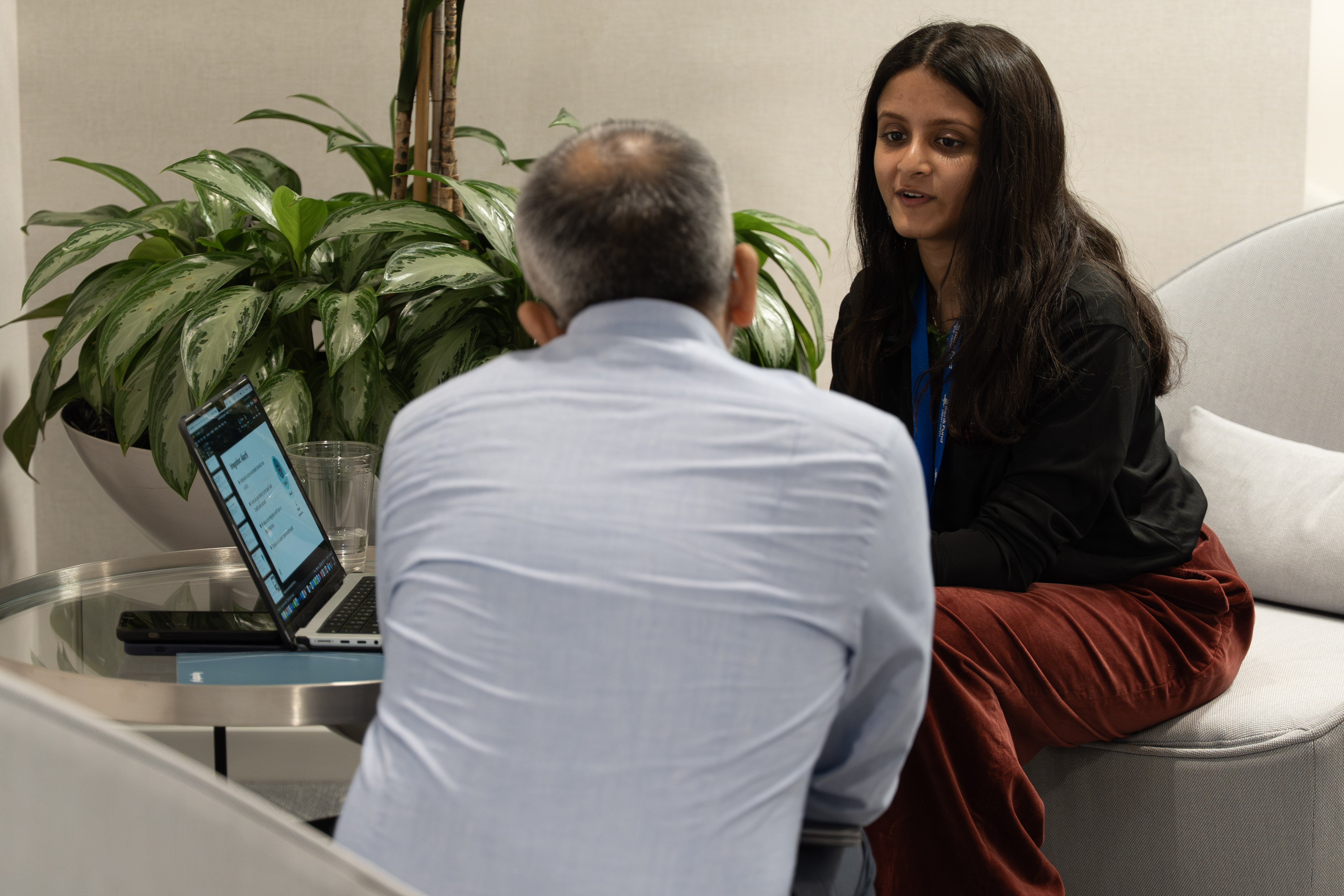 An accelerator founder speaking with a credit union executive during a Curql on-site session