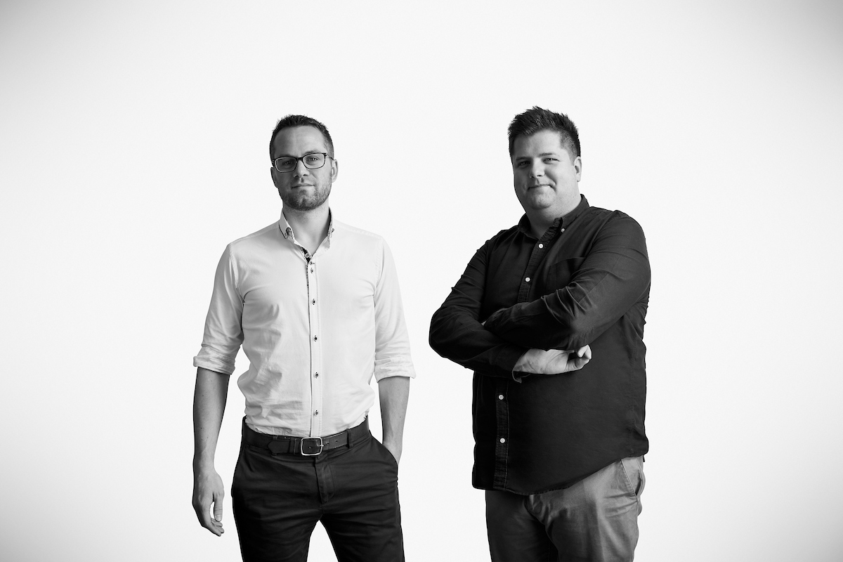 Current Health co-founders standing in a studio portrait