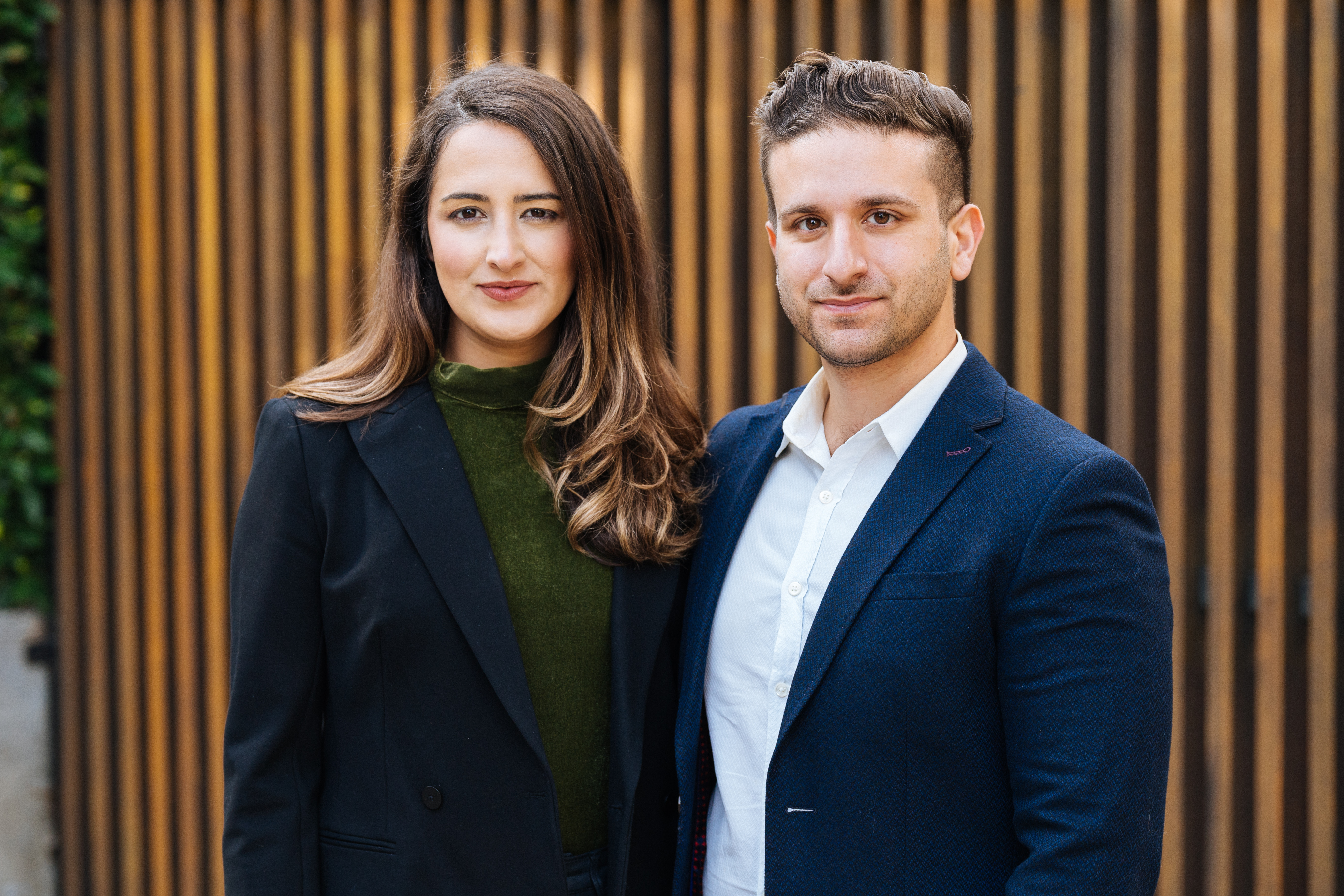 Currents Management co-founders Nilou and Cameron Ajdari standing together