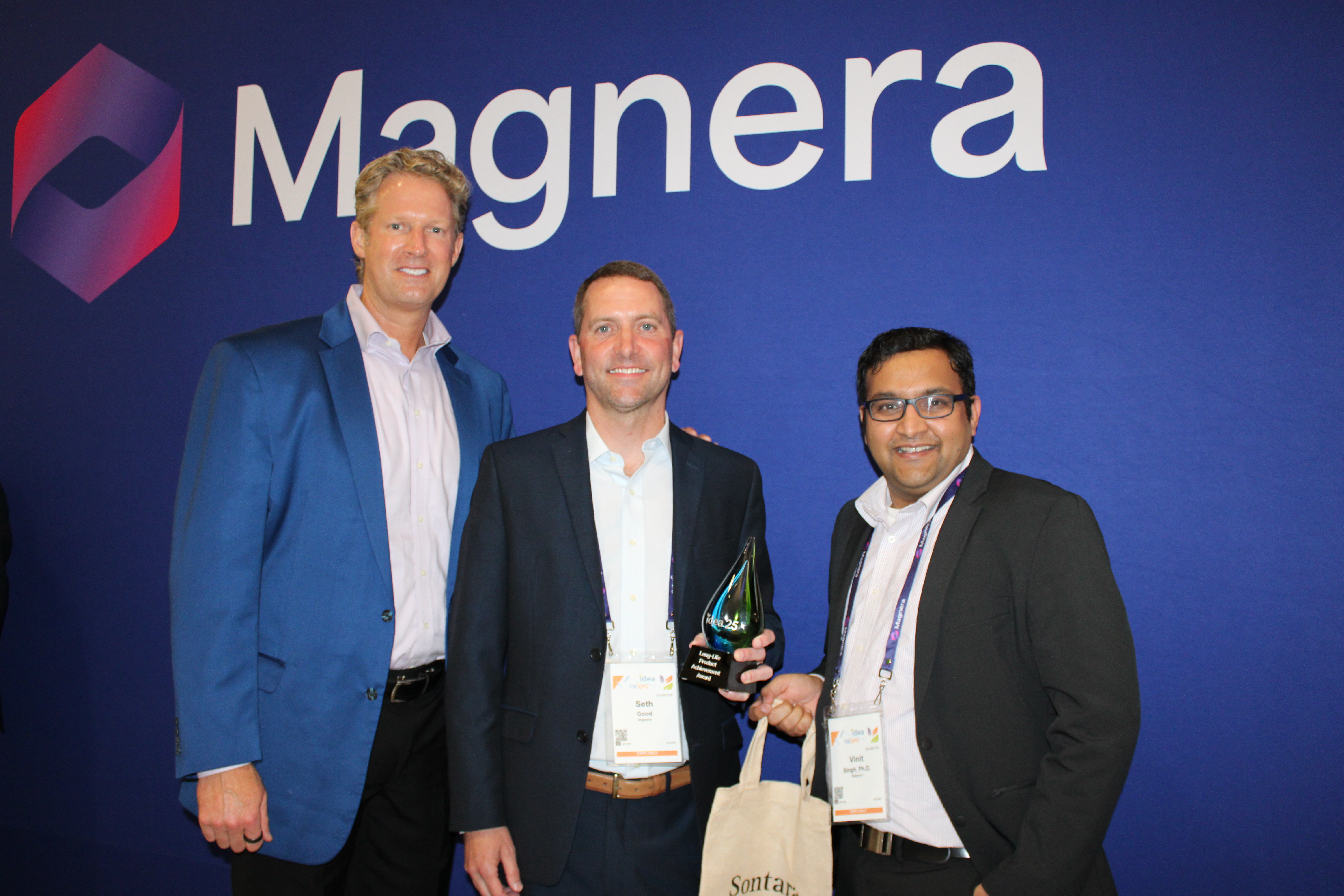 Curt Begle, Seth Good and Vinit Singh with the IDEA 25 award and a Sontara bag