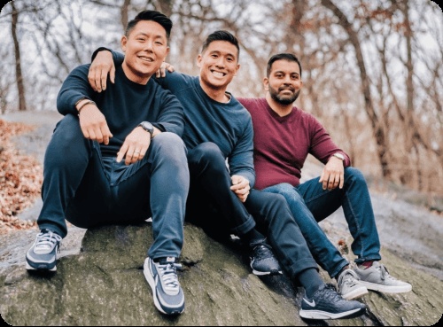 Pinwheel co-founders Curtis Lee, Kurt Lin and Anish Basu sitting outdoors