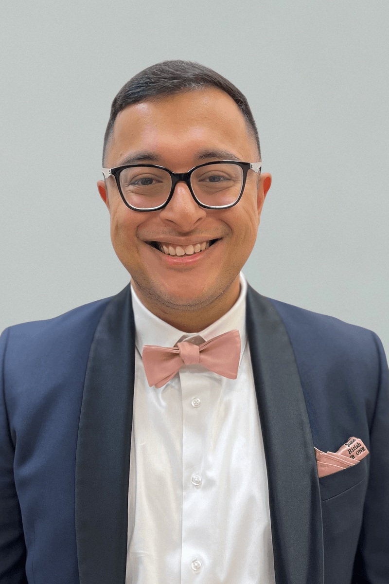 Curve Biosciences co-founder and CEO Ritish Patnaik wearing glasses and a pink bow tie