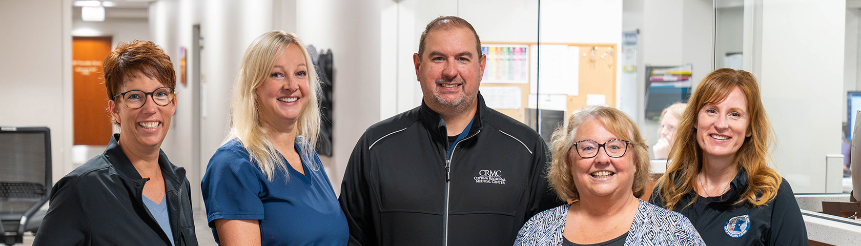 Five CRMC staff members pictured in a hospital corridor