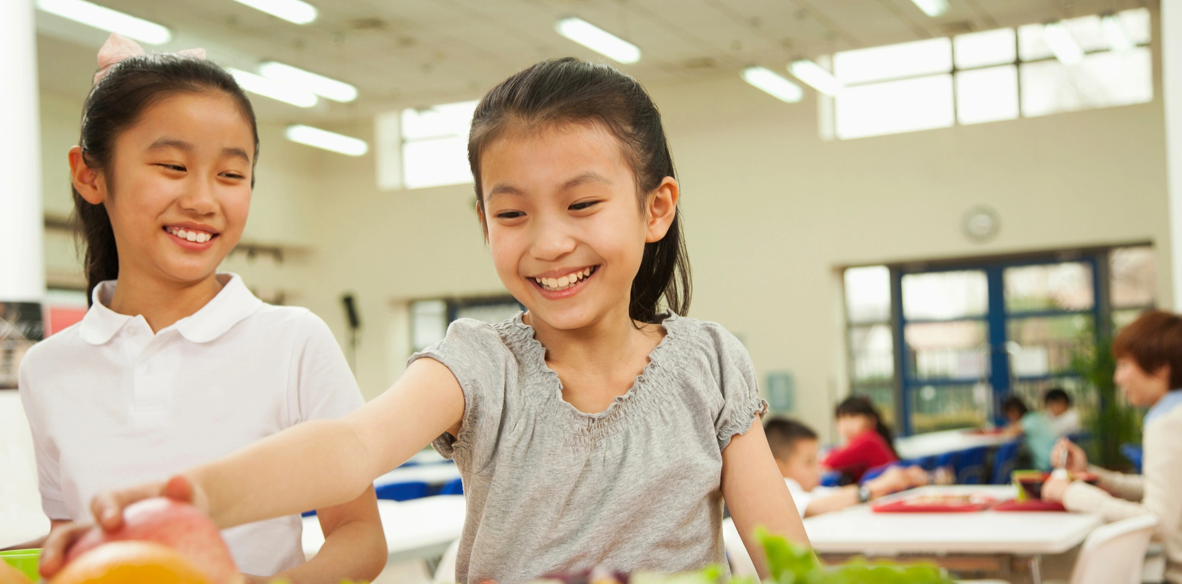 Students eating together in a school cafeteria, in a photograph published by SchoolCafé