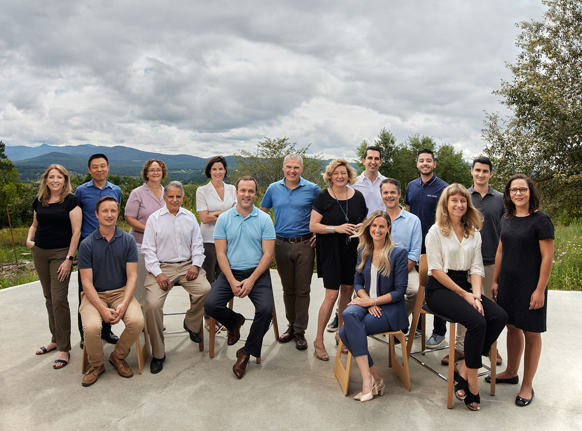 Cycle Capital team members posing outdoors in a historical company photograph