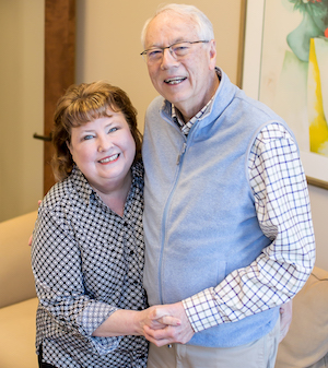 Cynthia Moxley standing beside her husband and former business partner Alan Carmichael