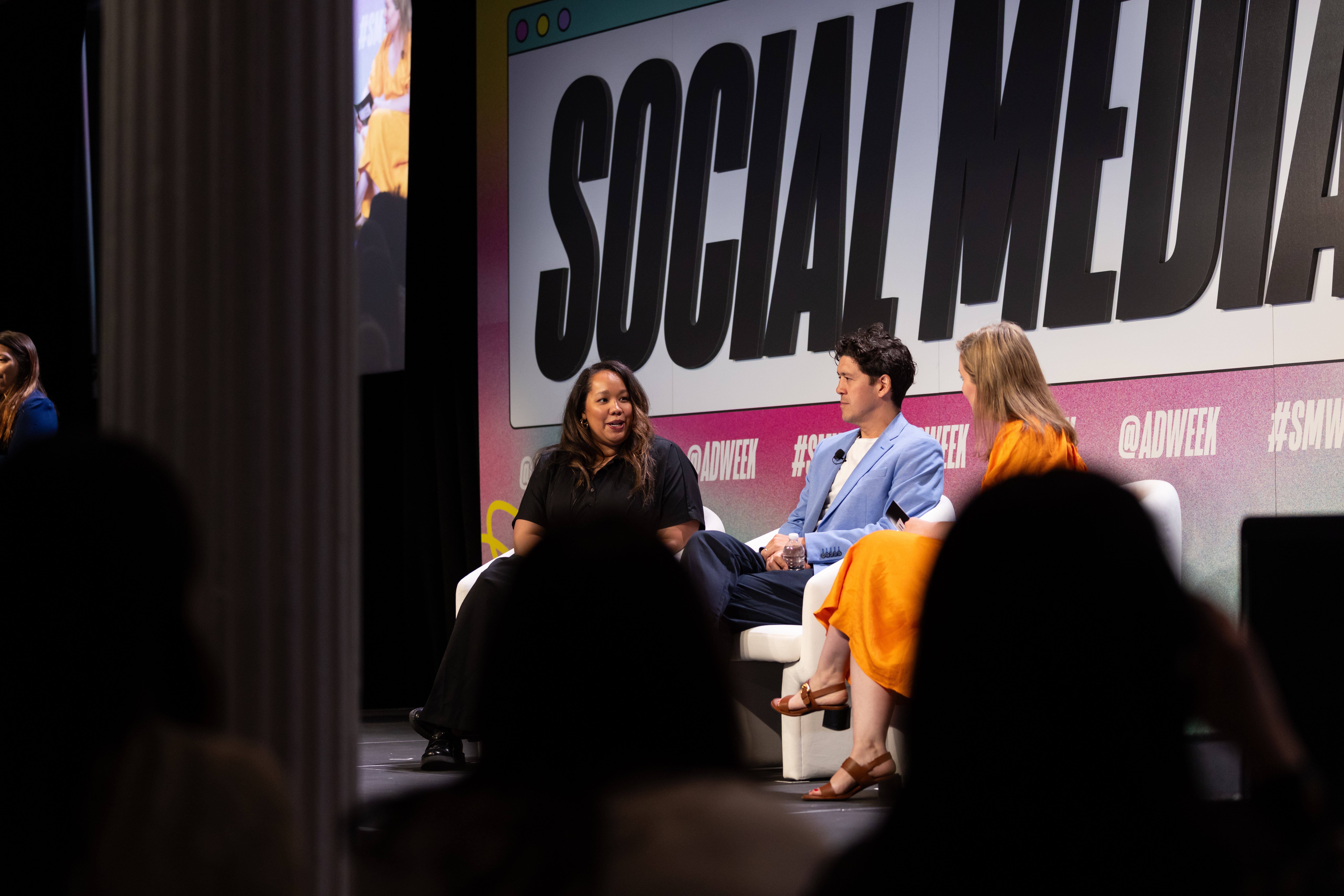 Cyntia Leo speaking with two fellow panelists on the Social Media Week stage