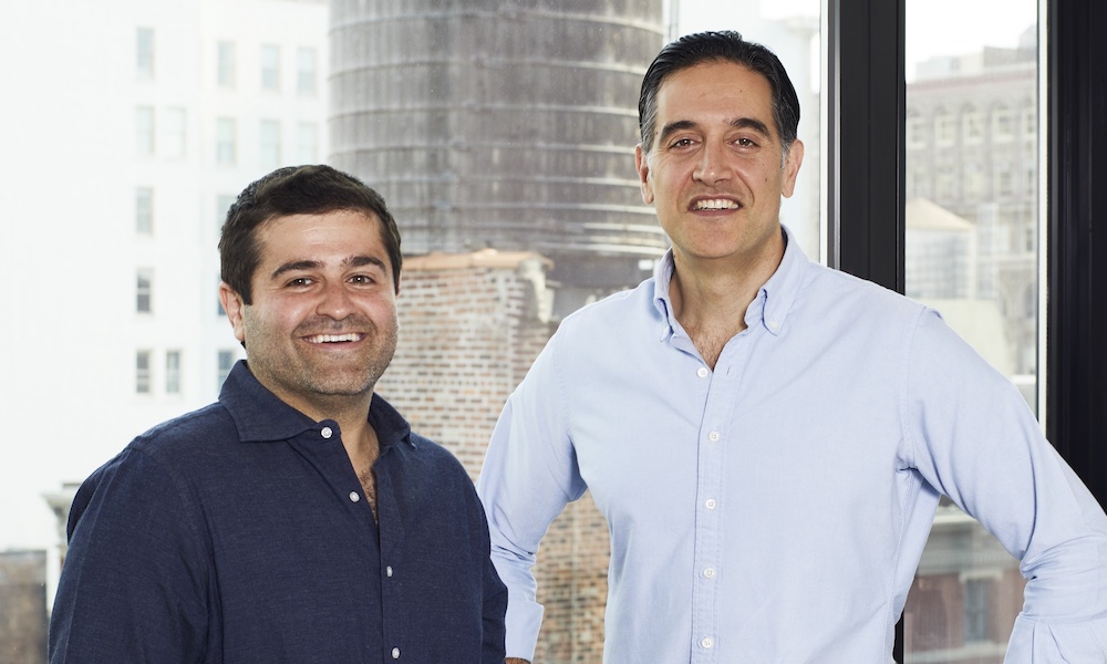 Slava Rubin and Cyrus Massoumi standing together in humbition’s office