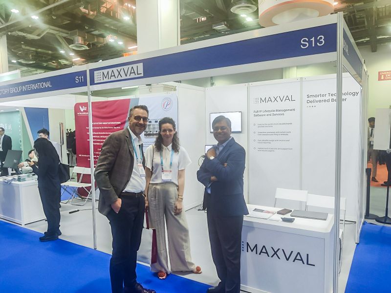 D. Bommi Bommannan at right with visitors at MaxVal’s exhibition booth in Singapore