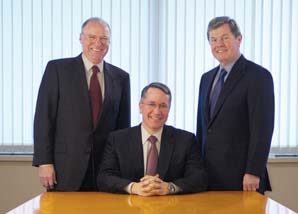 Phil Silver standing at left, Tony Allott seated in the middle and Greg Horrigan standing at right